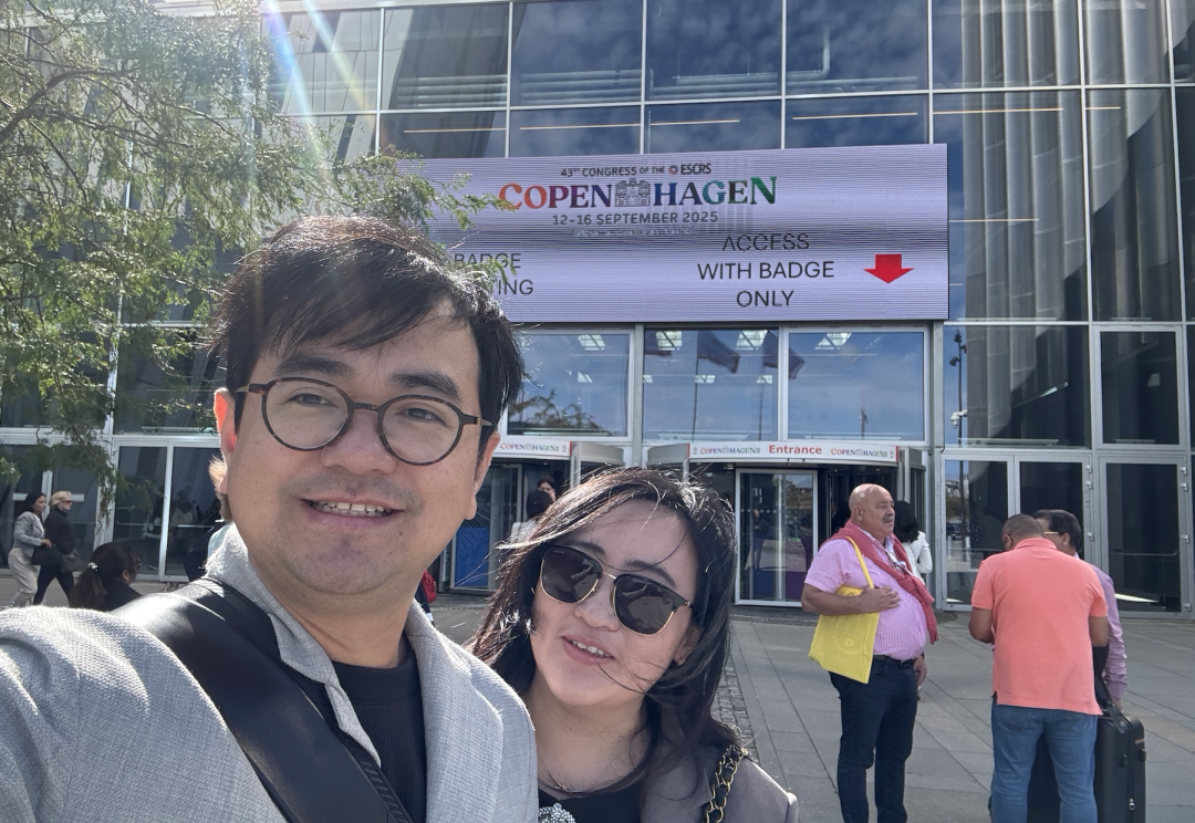 Two people at the entrance to the European Society of Cataract and Refractive Surgeons meeting in Copenhagen